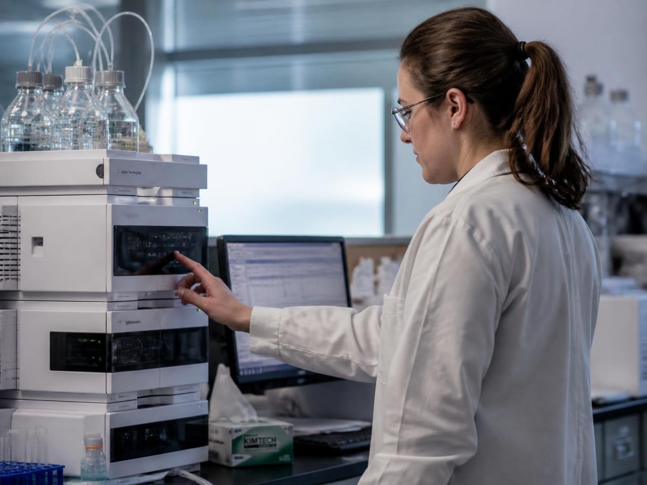 Scientist examining a test tube in a laboratory